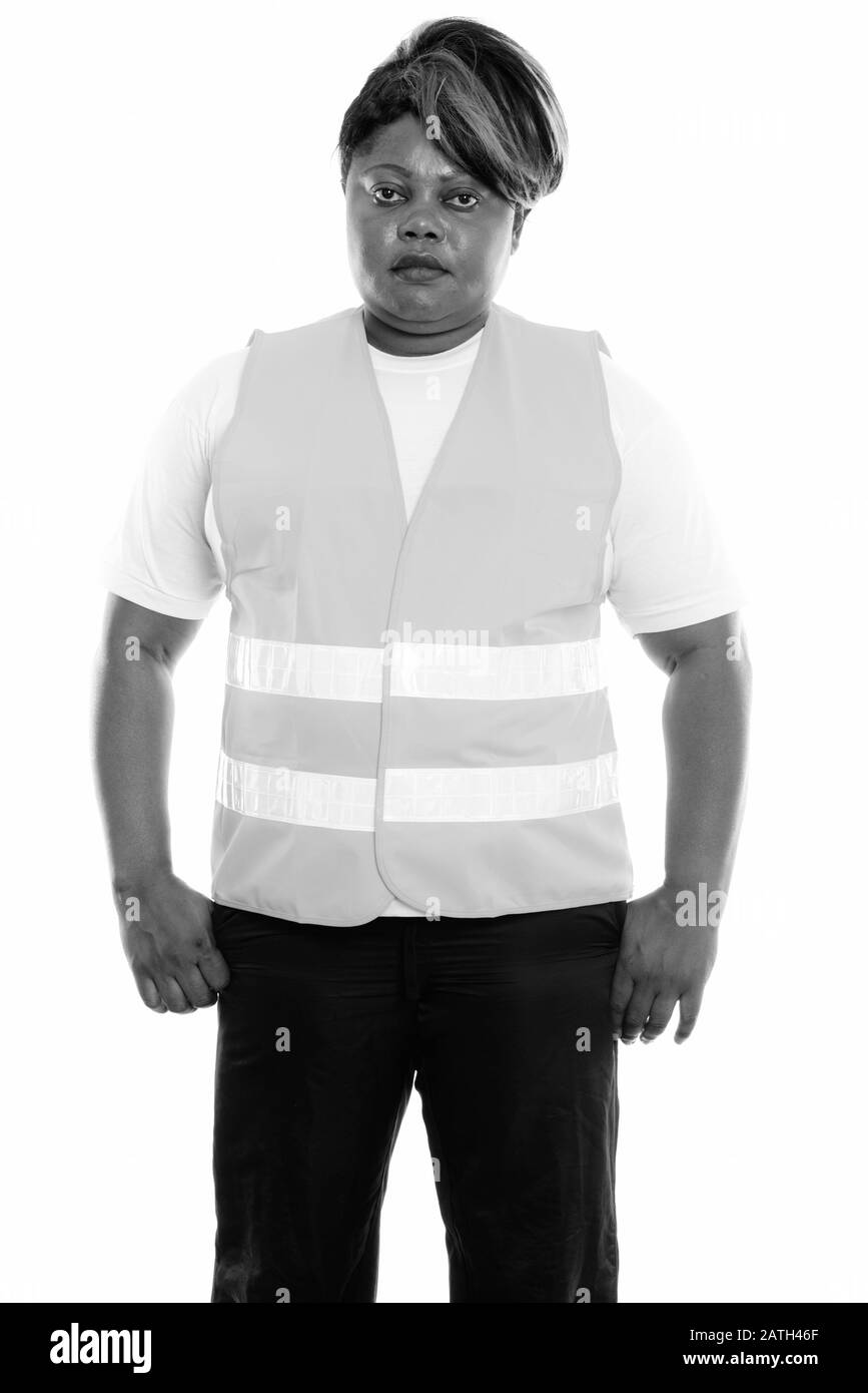 Studio Schuss von fettschwarzer afrikanischer Frau Bauarbeiter stehend Stockfoto