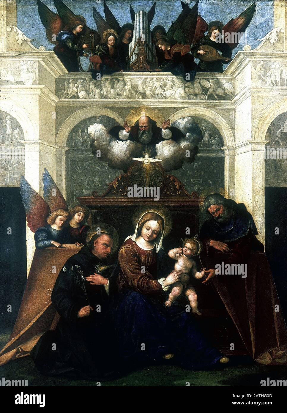 Ludovico Mazzolino Italienische Schule Die heilige Familie mit dem heiligen Nikolaus von Tolentino, der Dreifaltigkeit und den Engeln Ca. 1520 Öl auf Holz (80,6 x 62,2 cm) London, Nationalgalerie Stockfoto
