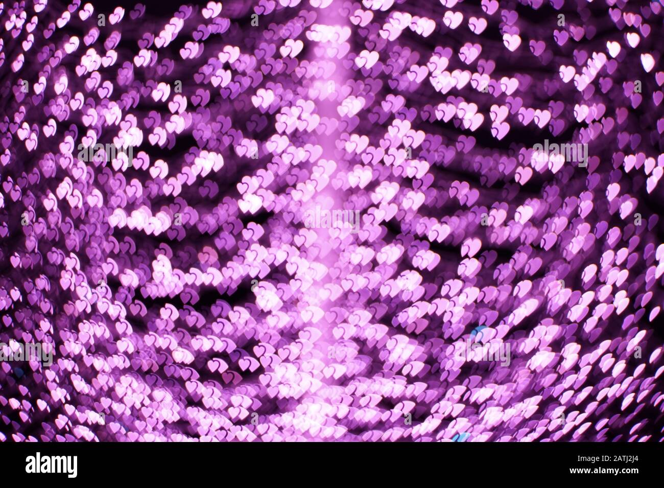 Rosafarbene Herzen bokeh Lichter. Schöner Hintergrund für den Valentinstag Stockfoto