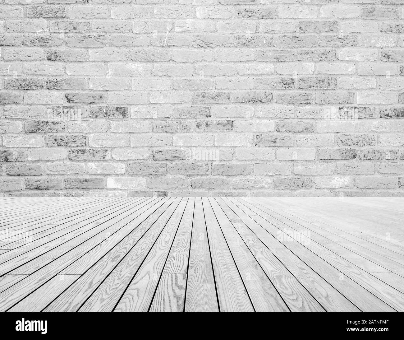 Hellgraue und weiße Ziegelsteine an der Wand und weiße Holzfußbodendekoration. Struktur- und Hintergrundkonzept Stockfoto