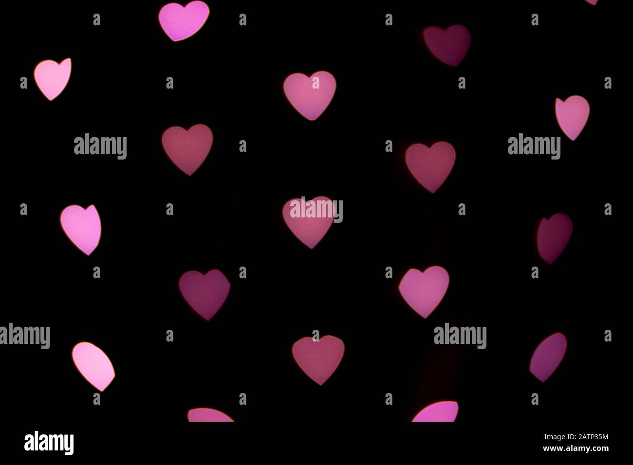 Valentines Hintergrund. Abstrakter Hintergrund des Herzens. Unscharfe, herzförmige Lichter. Liebeskonzept. Stockfoto