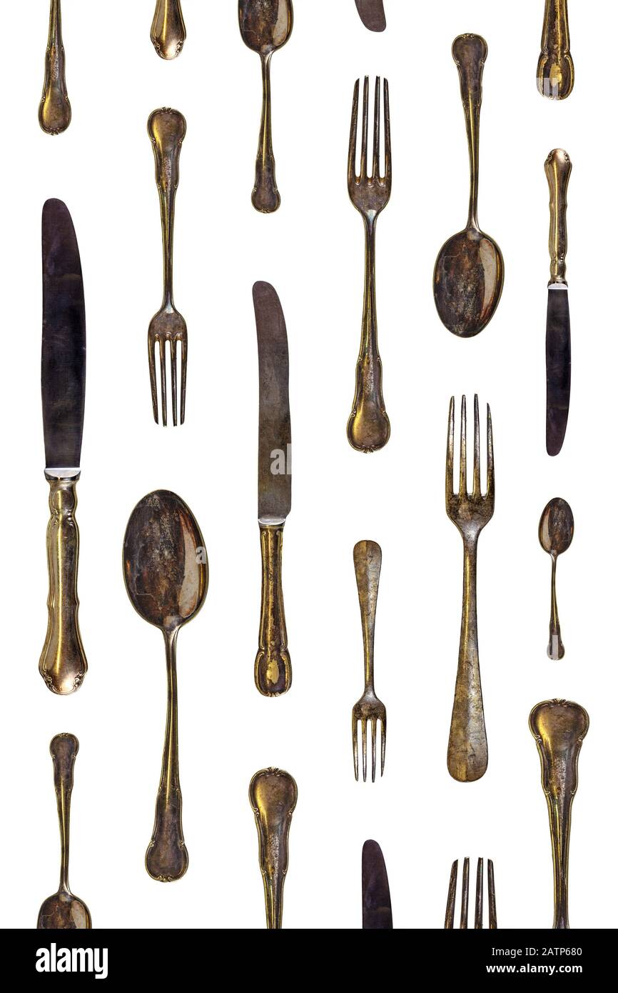 Muster aus Vintage-Löffeln, Messern und Gabeln isoliert auf weißem Hintergrund Stockfoto