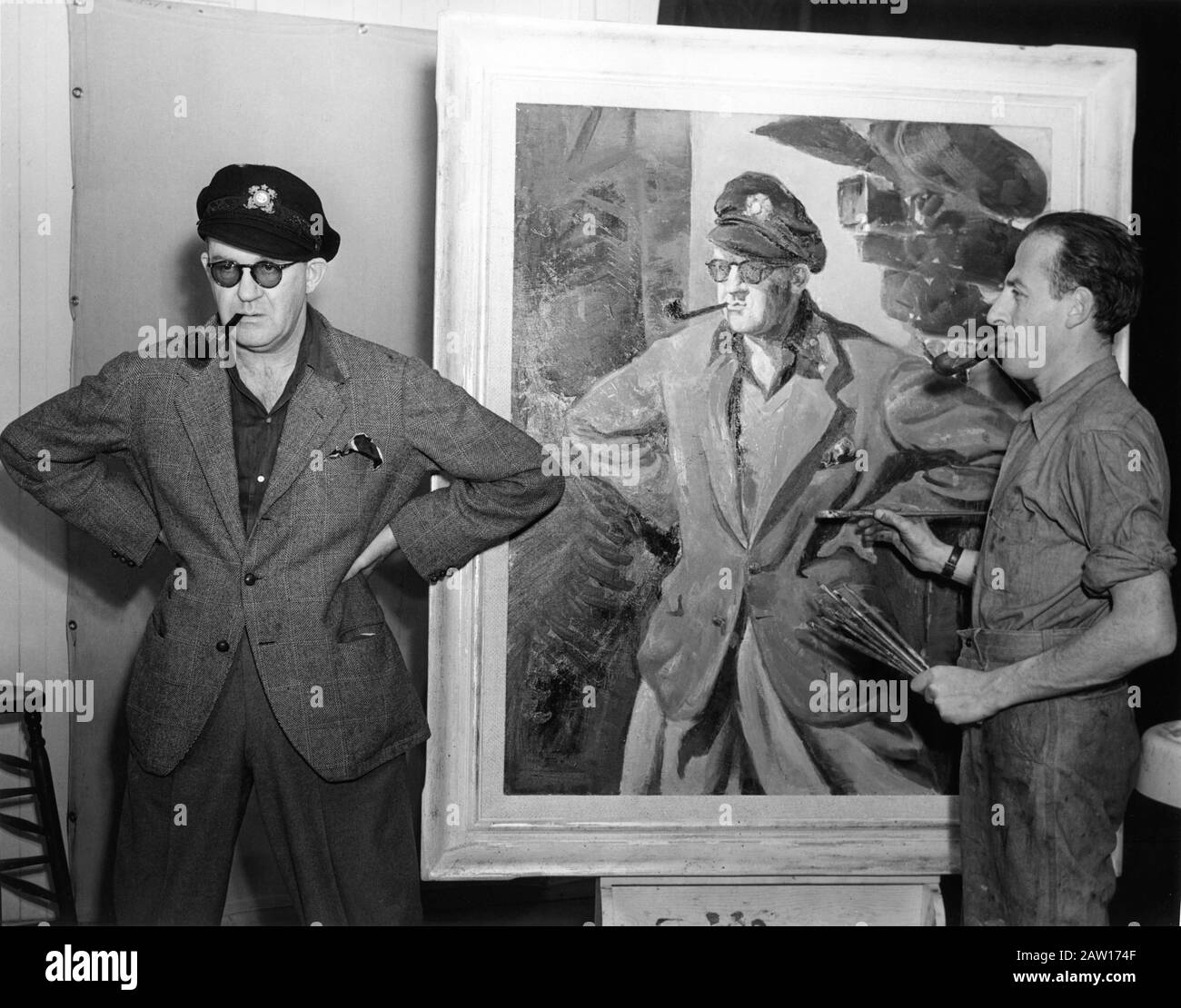 Regisseur JOHN FORD und Künstler GEORGES SCHREIBER mit seinem Painted Portrait des Regisseurs während der Dreharbeiten zu THE LONG VOYAGE HOME 1940 basierend auf Vier Sea Plays von Eugene O'Neill, die von Dudley Nichols Walter Wanger Productions / Argosy Pictures / United Artists adaptiert wurden Stockfoto