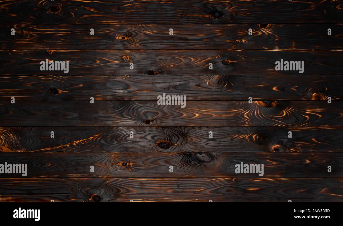 Verbrannte Holzbretttextur, schwarz gebrannter Hintergrund Stockfoto