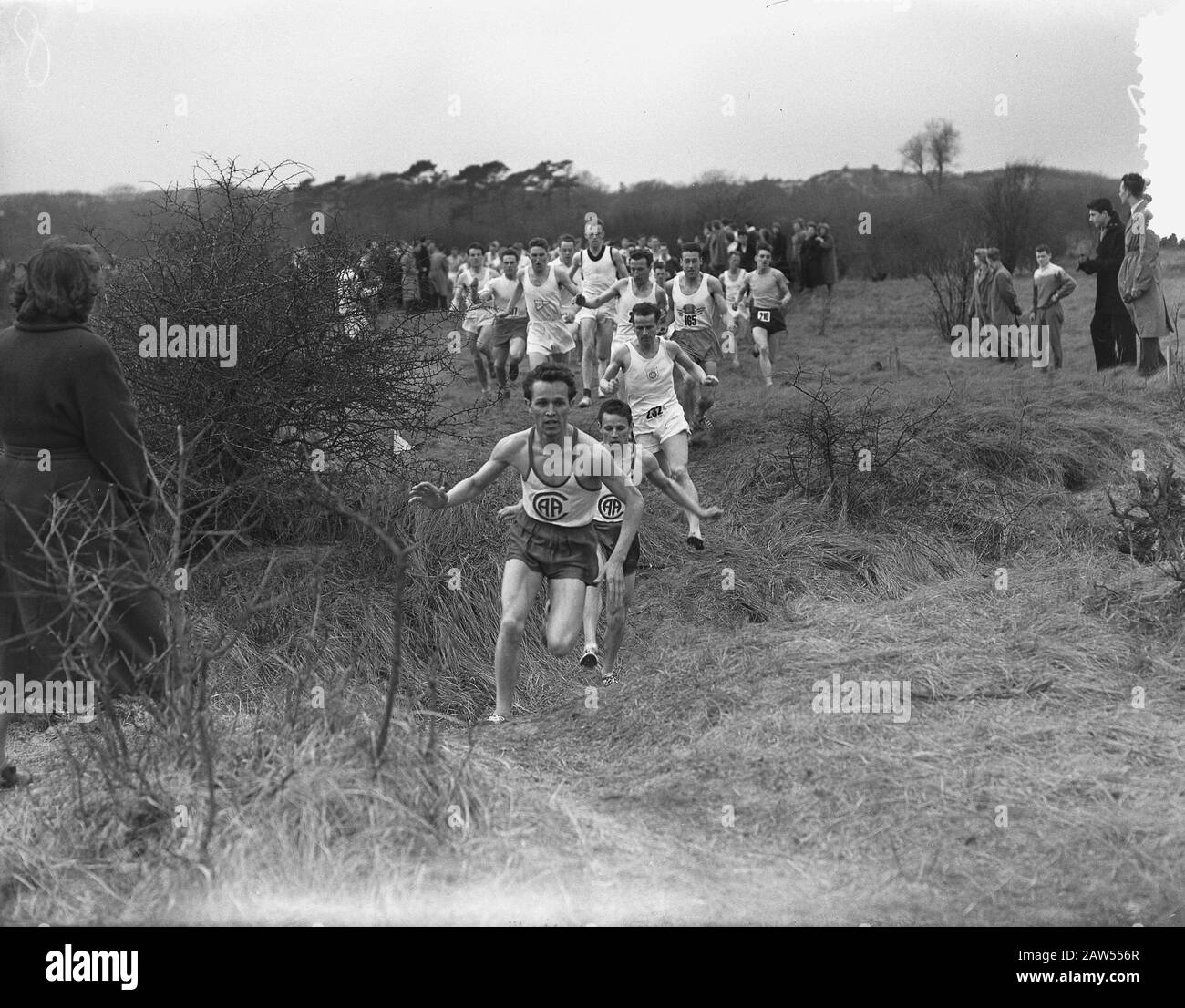 Nationale Crosslauf-Meisterschaften 1954 in Heerenduinen IJmuiden Datum: 29. März 1954 Ort: IJmuiden Schlüsselwörter: Meisterschaften, Querfeldein-Personenname: Heerenduinen Stockfoto