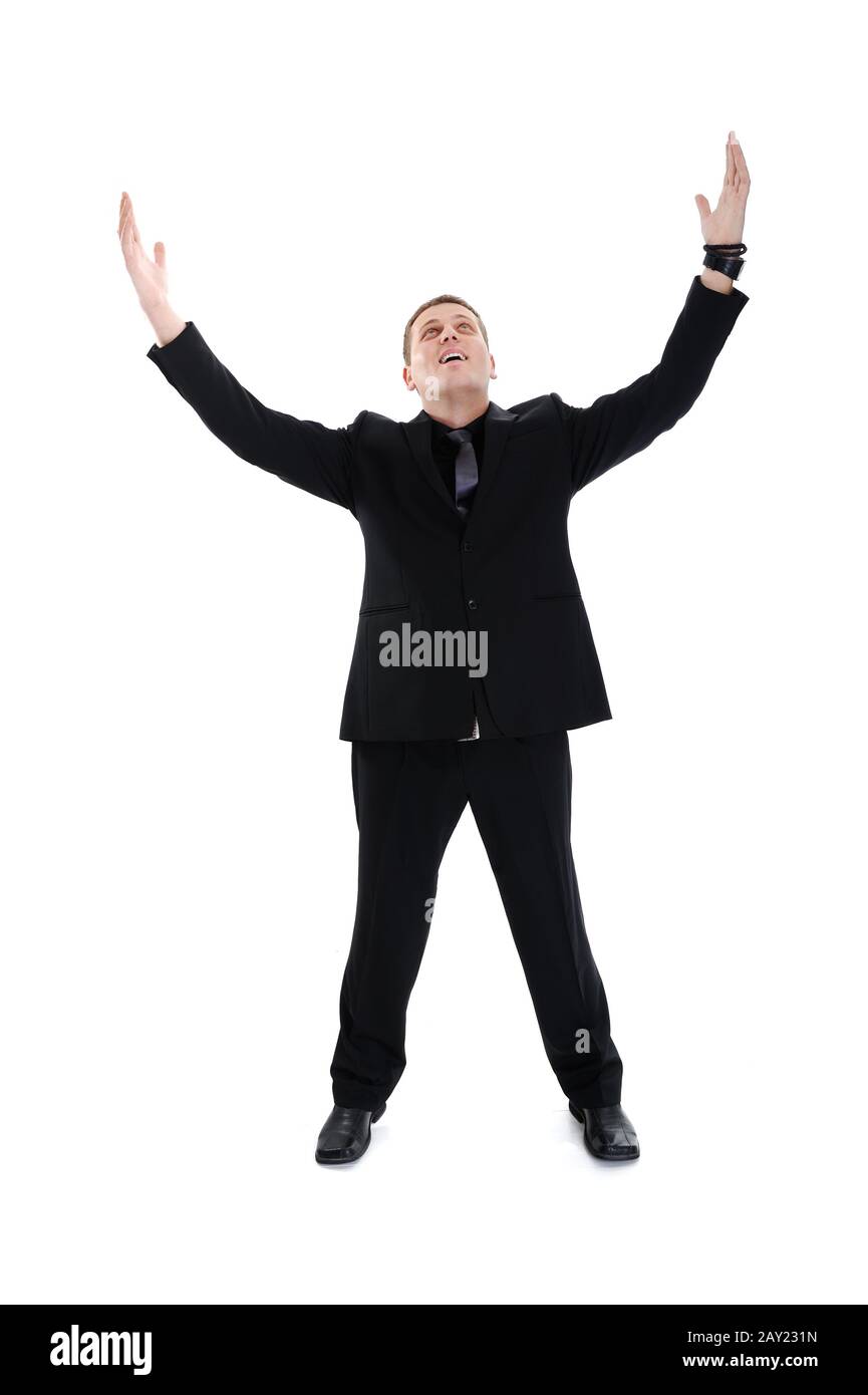 Porträt des jungen, glücklichen Gewinner-Kaufmanns mit weit über weißem Hintergrund geöffneten Armen Stockfoto