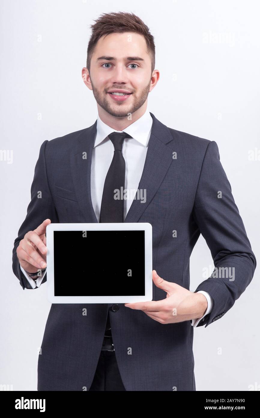 Bild eines attraktiven Geschäftsmannes mit Tablet-Computer Stockfoto