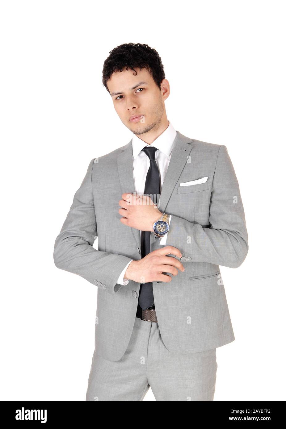 Business man steht entspannt und ist ein grauer Anzug, der halbiert ist Stockfoto