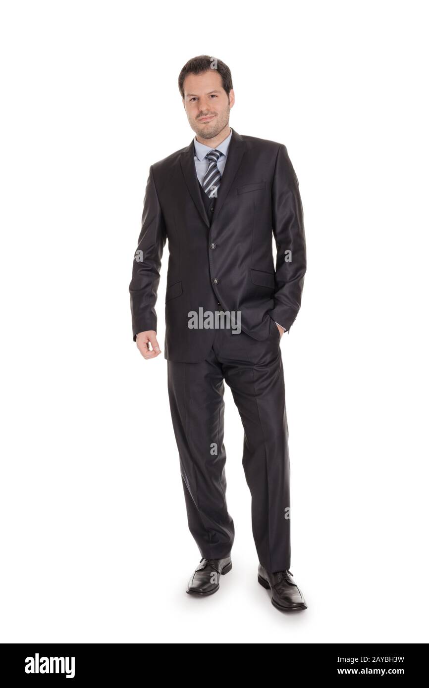 Smart Businessman in einem schwarzen Anzug in voller Körperlänge isoliert auf weißem Hintergrund. Geschäftskonzept Stockfoto
