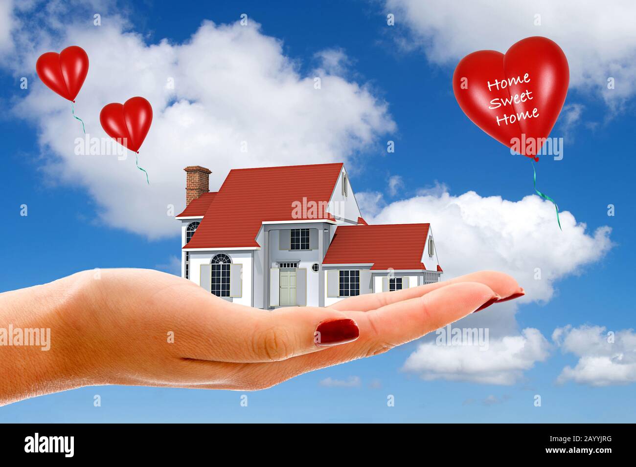 Hand mit privat geführtem Haus und Ballons Schriftzug Home swet Home, Composing, Deutschland Stockfoto