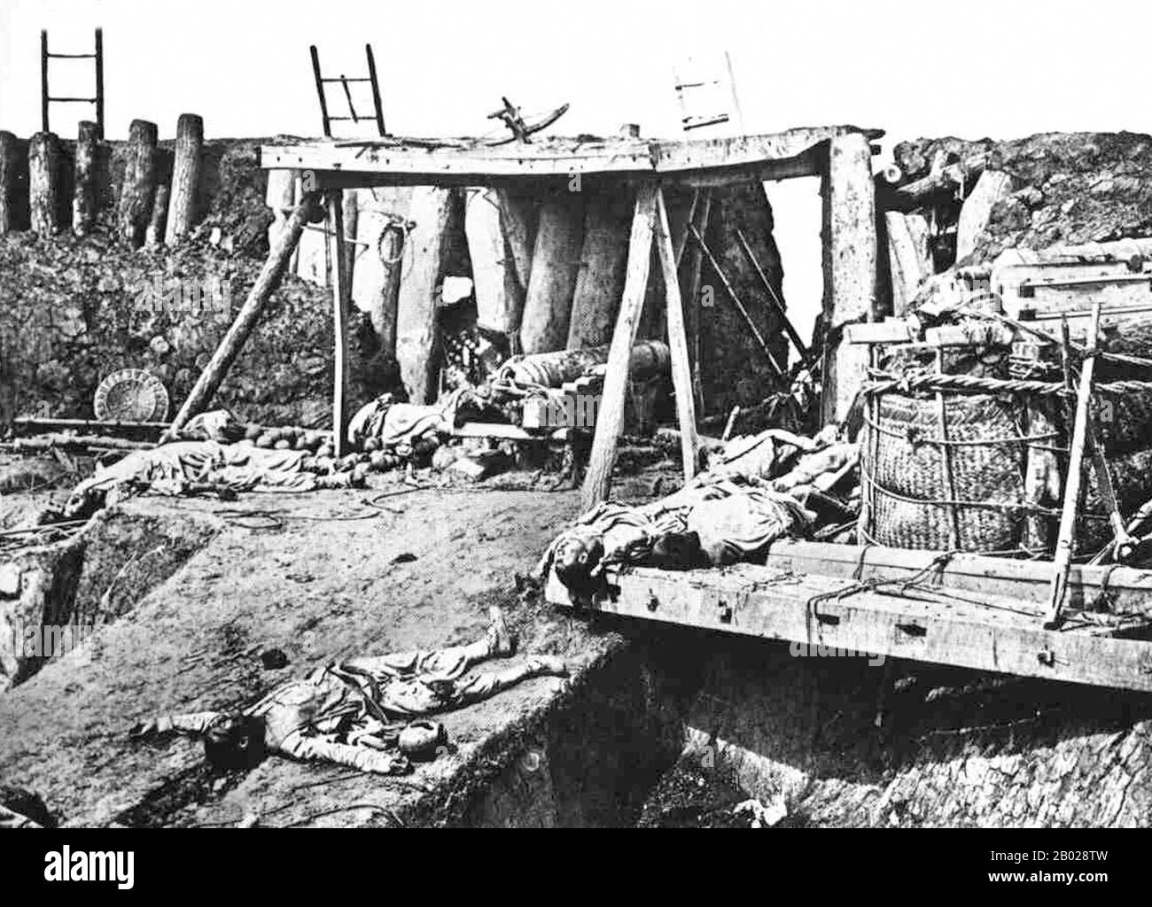 China: Die Leichen toter chinesischer Soldaten in den Forts Dagu oder Taku. Foto von Felice Beato (1832-1909), 21. August 1860. Die Taku Forts oder Dagu Forts (Pinyin: Dàgū Pàotái; wörtlich „Taku Batterien“), auch Peiho Forts (Pinyin: Báihé Diāobǎo) genannt, sind Festungen an der Mündung des Hai Flusses (Peiho River) im Bezirk Tanggu, Gemeinde Tianjin, im Nordosten Chinas. Sie befinden sich 60 km südöstlich des Stadtzentrums von Tianjin. Im Jahr 1856 stiegen chinesische Soldaten an Bord der Arrow, ein chinesisches Schiff, das unter britischer Flagge in Hongkong registriert war und der Piraterie und des Opiumschmuggels verdächtigt wurde. Stockfoto