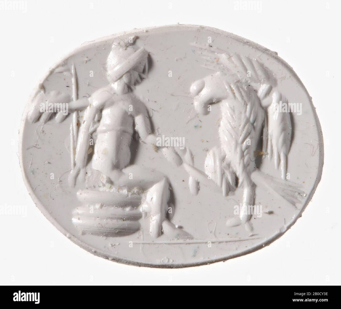 VZ: Ganymedes sitzt auf einem Felsen, er trägt einen Gürtel und eine phrygische Mütze, mit der rechten Hand berührt er die rechte Klaue eines Adlers, in der linken Hand hat er wahrscheinlich ein Lagobolon, der Adler ist aufrecht dargestellt. , Schmuckstein, Intaglio, Ringstein, karnelisch, Farbe: Rosa Stockfoto