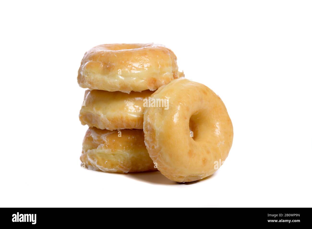 Mehrere glasierte Donuts auf weißem Grund Stockfoto