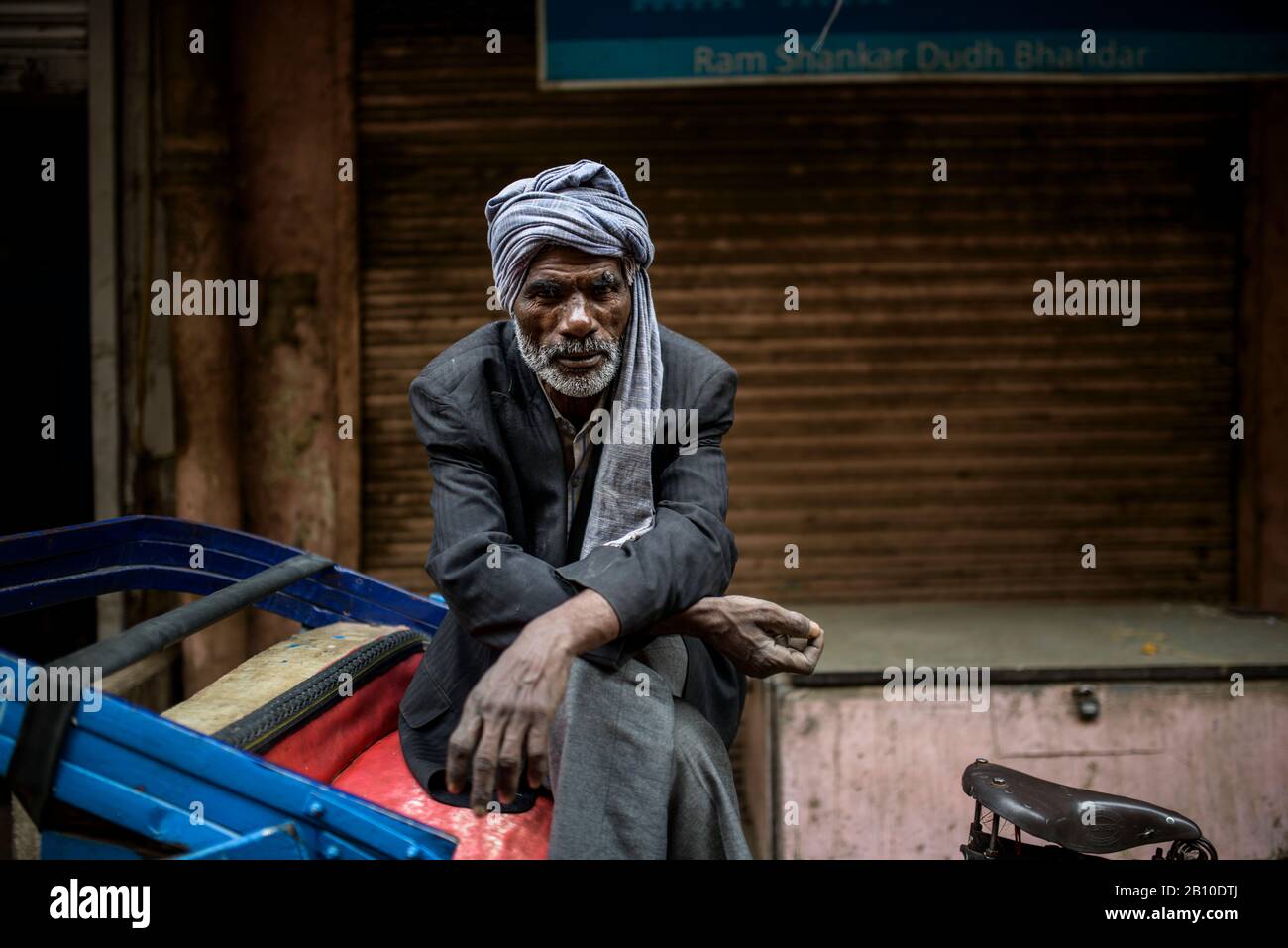 Fahrradrohrshaw Fahrer ruht, Old Delhi, Indien Stockfoto