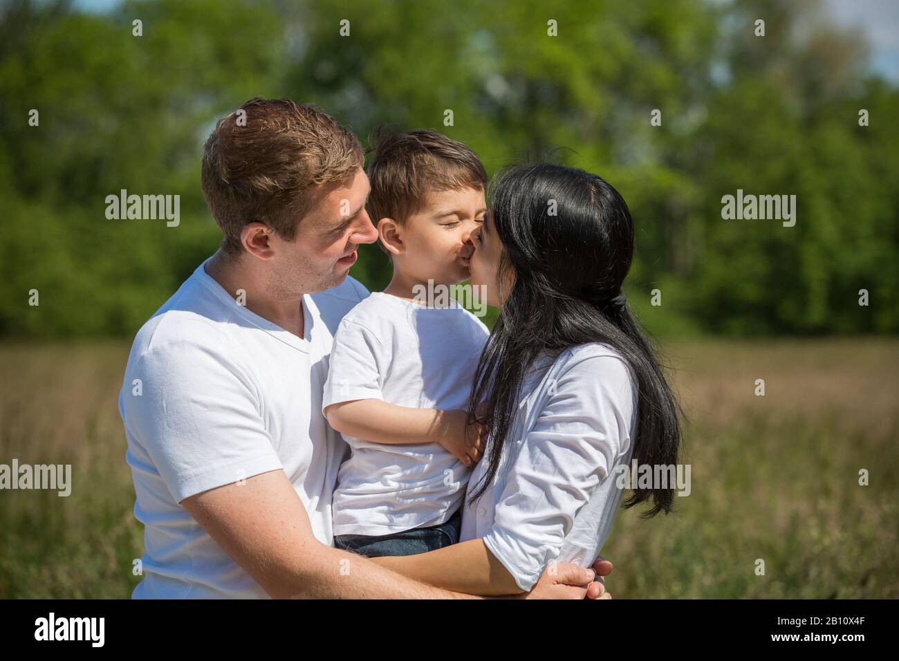 Kleine Familie mit einem Kind Stockfoto