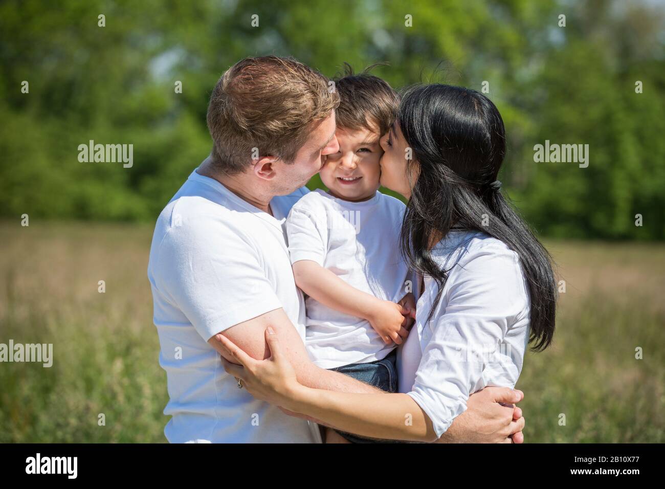 Kleine Familie mit einem Kind Stockfoto