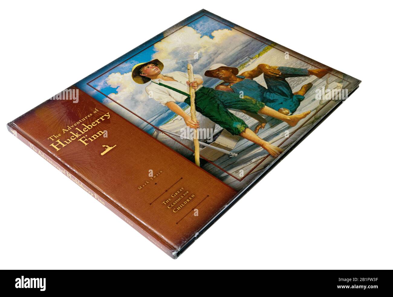 Eine schöne illustrierte Ausgabe von Huckleberry Finn von Mark Twain, die Huck und dem entflohenen Sklaven Jim auf dem Floß zeigt Stockfoto