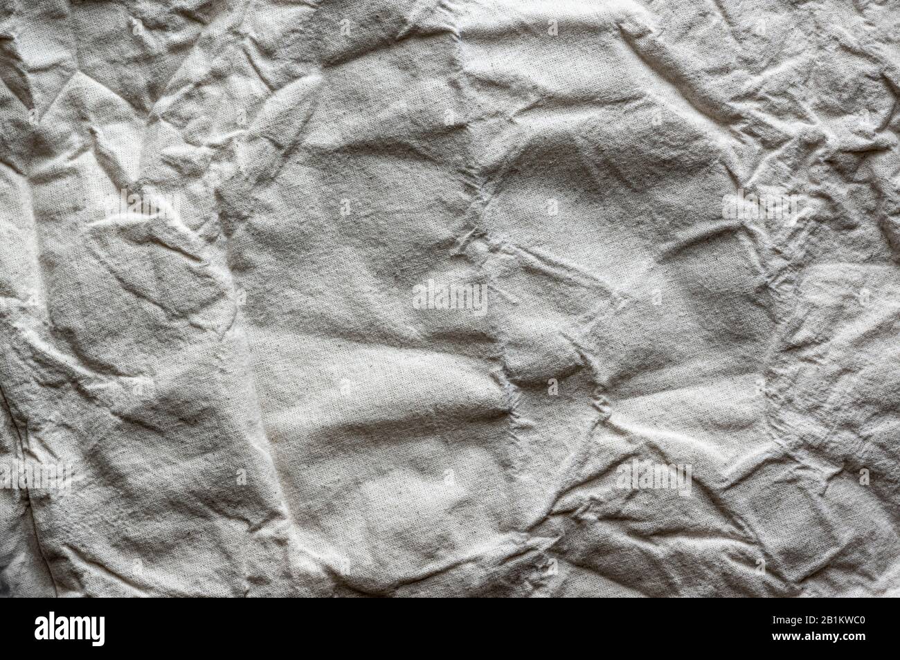 Geknitterte Gewebestruktur. Hintergrund des zerknitterten Stoffs Stockfoto