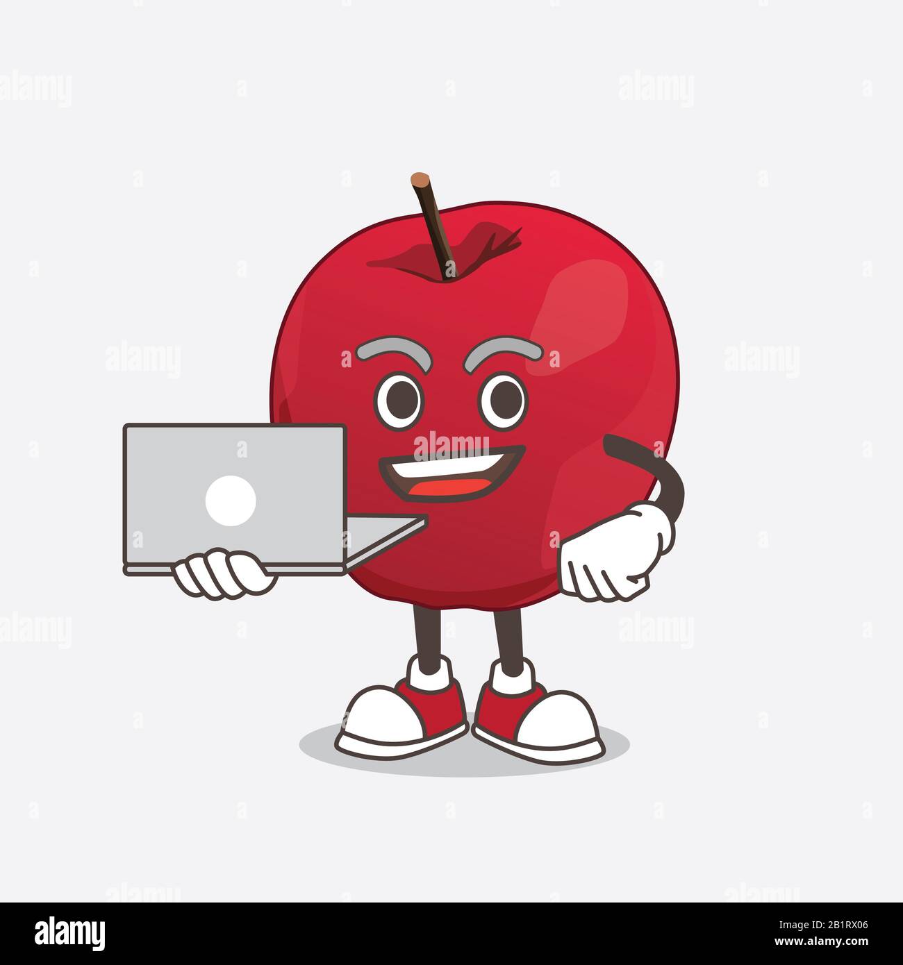 Apple Cartoon Maskottchen mit Laptop Stockfoto