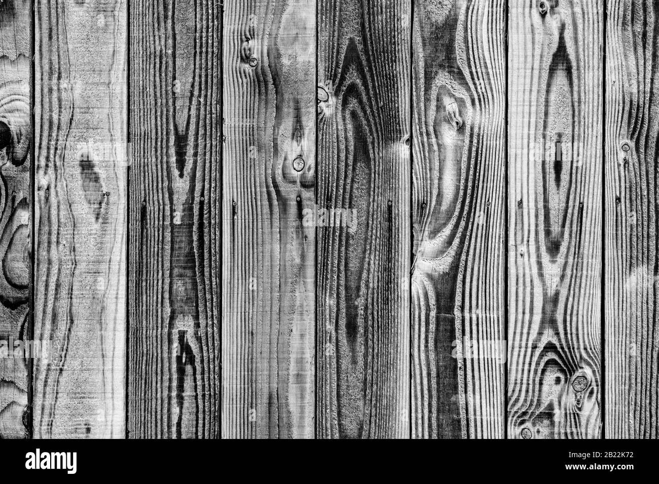 Nahtloser Hintergrund von schwarz-weißen Holzbohlen Stockfoto