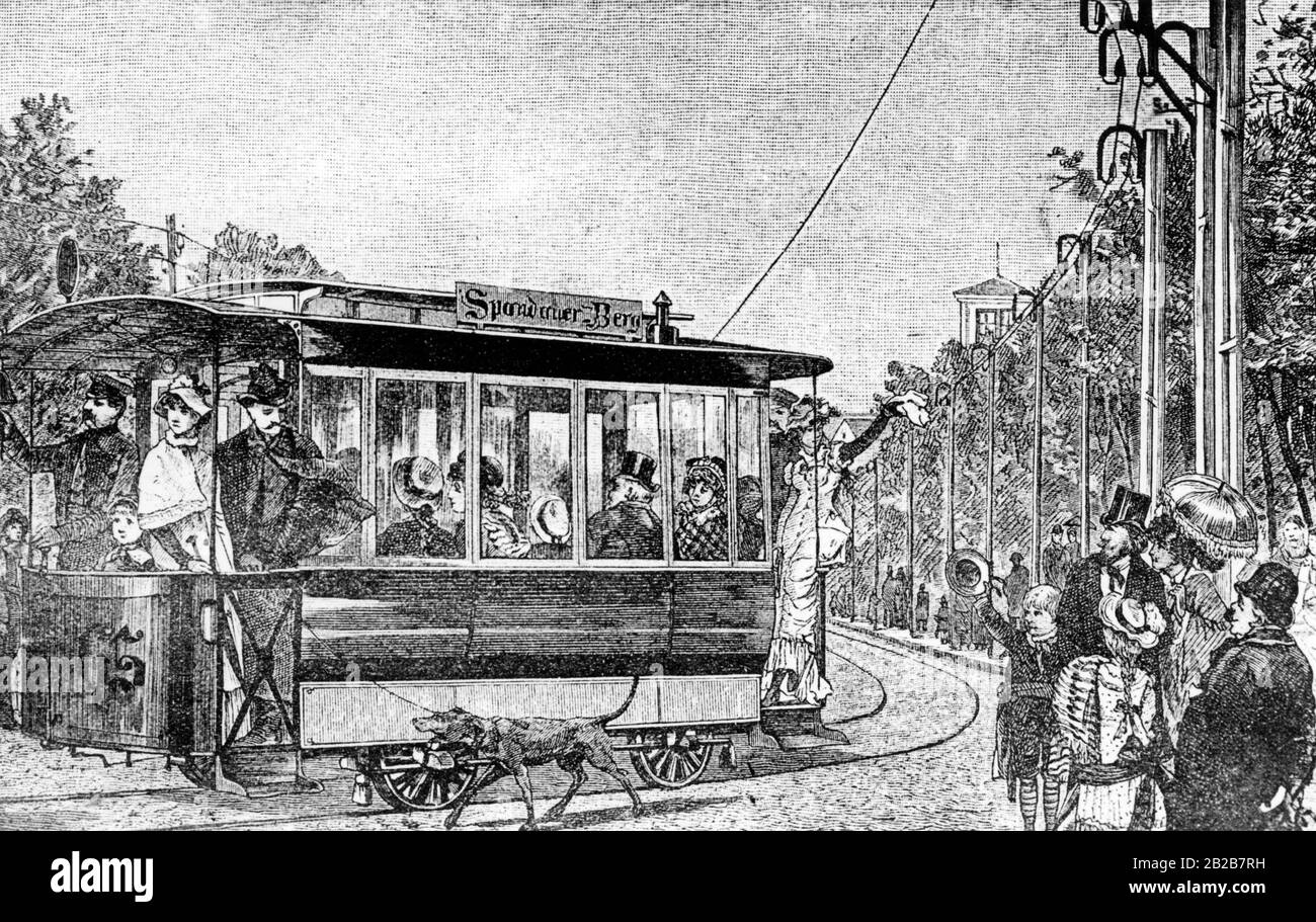 Die erste elektrische Straßenbahn, die über eine Oberleitung mit Strom versorgt wurde, verkehrte zwischen Westend und dem Spandauer Berg. Auf der Straßenbahn-Pkw-Nr 65 der Fahrer warnt Passanten vor der herannahenden Straßenbahn, indem er eine Klingel klingelt. Nach einer Zeichnung von F. Wittig. Stockfoto