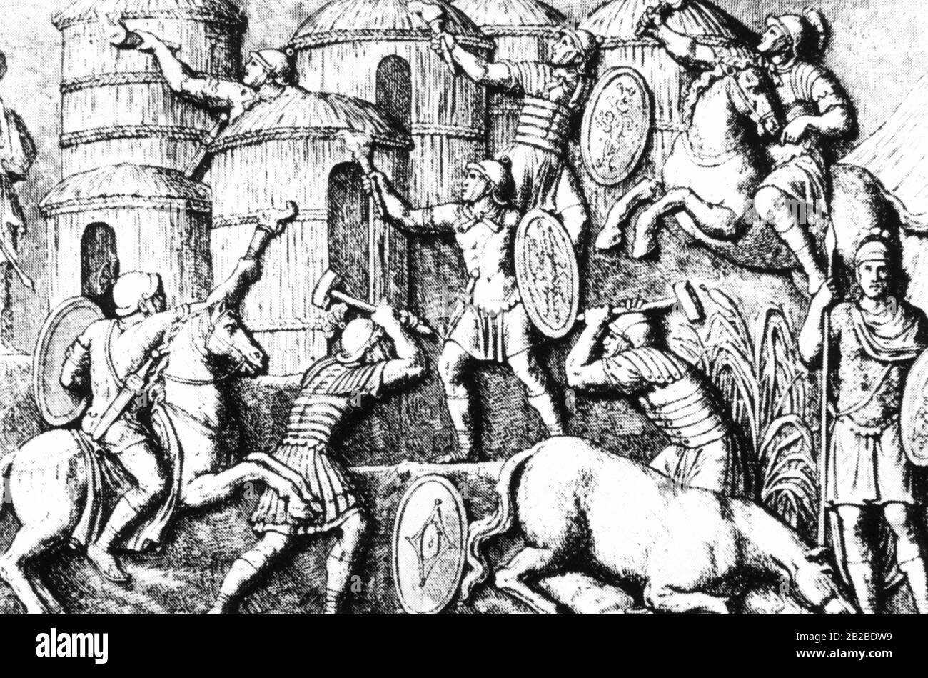 Diese zeitgenössische Erleichterung zeigt römische Legionäre, die ein deutsches Dorf in Brand gesteckt haben, nachdem sie ihre Einwohner getötet oder gefangen genommen hatten. Der Widerstand gegen die römische Herrschaft wurde immer mit diesen Methoden gebrochen. Stockfoto