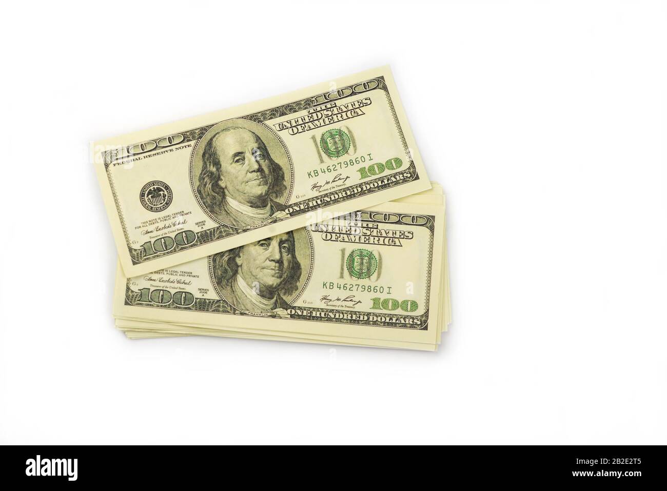 Hintergrund einer Menge Geldscheine Bargeld 100 Dollar kanadisch-amerikanisch in einem Haufen auf einem weißen isolierten Hintergrund Stockfoto