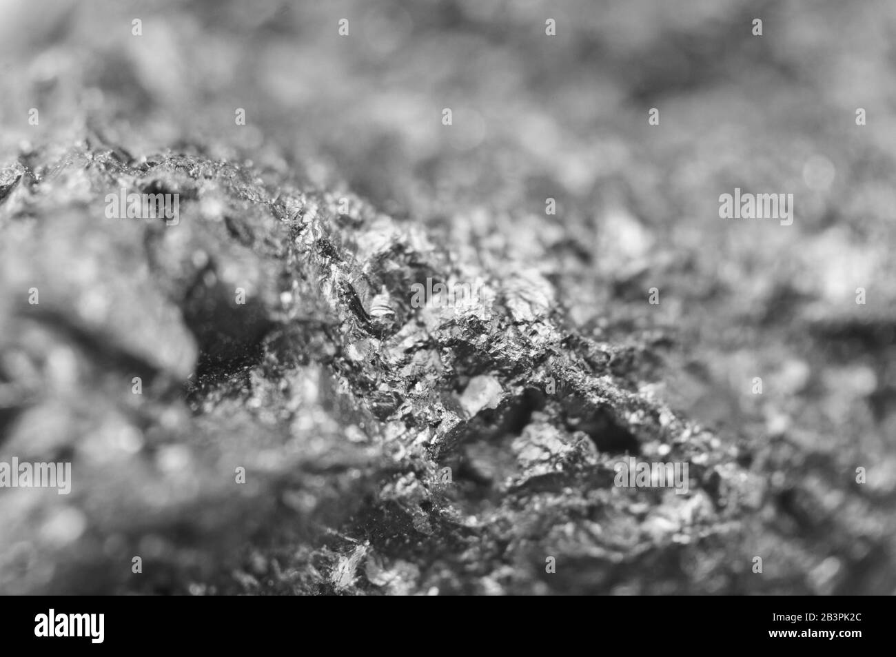 Nugget. Makro. Wunderschöner, abstrakter Hintergrund. Schwarz-weiß Stockfoto