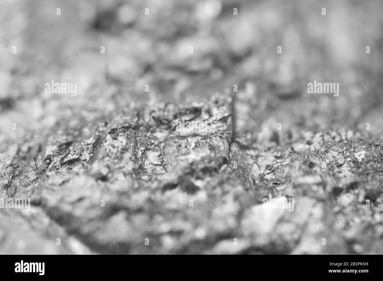 Nugget. Makro. Wunderschöner, abstrakter Hintergrund. Schwarz-weiß Stockfoto