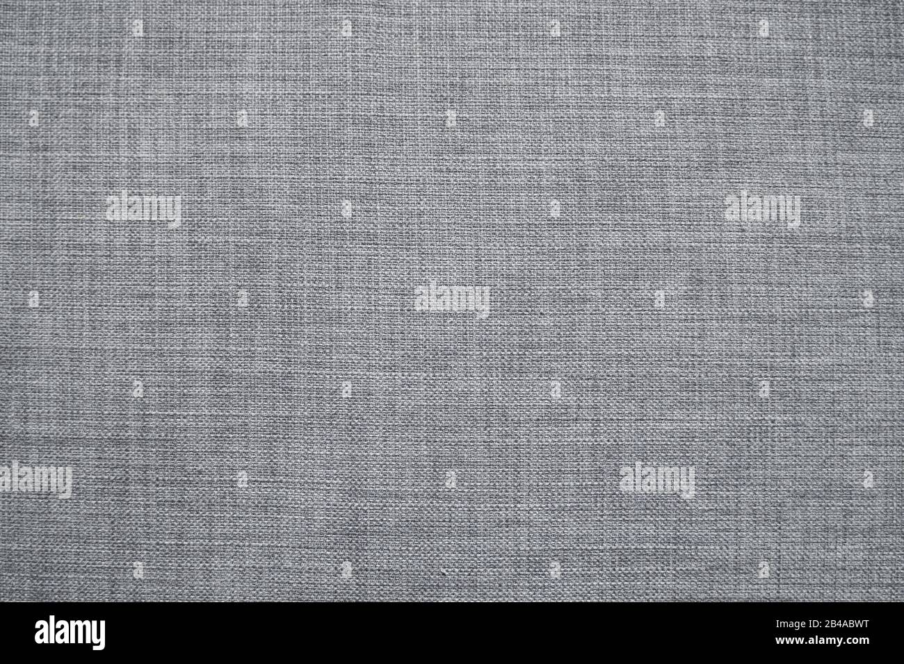 Details zum Hintergrund der textilen Struktur aus grauem Stoff. Stockfoto