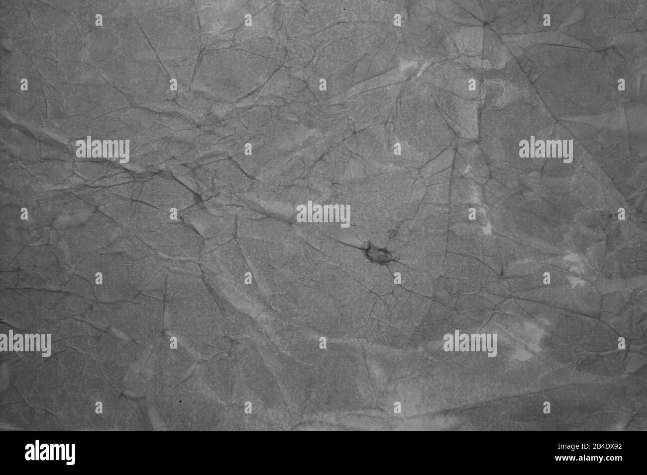 Textur des grau zerknitterten Papiers für den Hintergrund. Stock-Foto mit leerem Platz für Web, Druck, Hintergrundbild und Hintergrund. Stockfoto