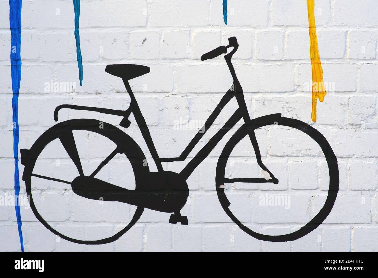 Die Zeichnung und die Umrisse eines Fahrrads auf eine Wand mit Farbverläufen. Stockfoto