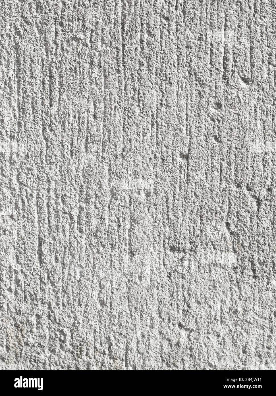 Alte weiße Wand mit kleinen senkrechten Rillen Stockfoto