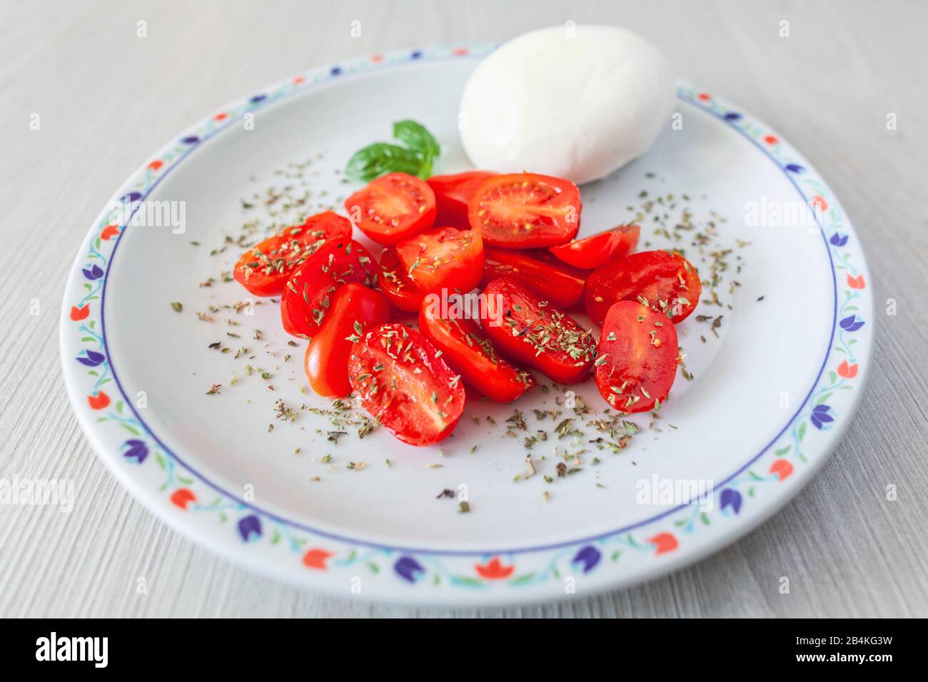 Italienische Küche, Caprese, Mozzarella, Tomaten und Origan Stockfoto