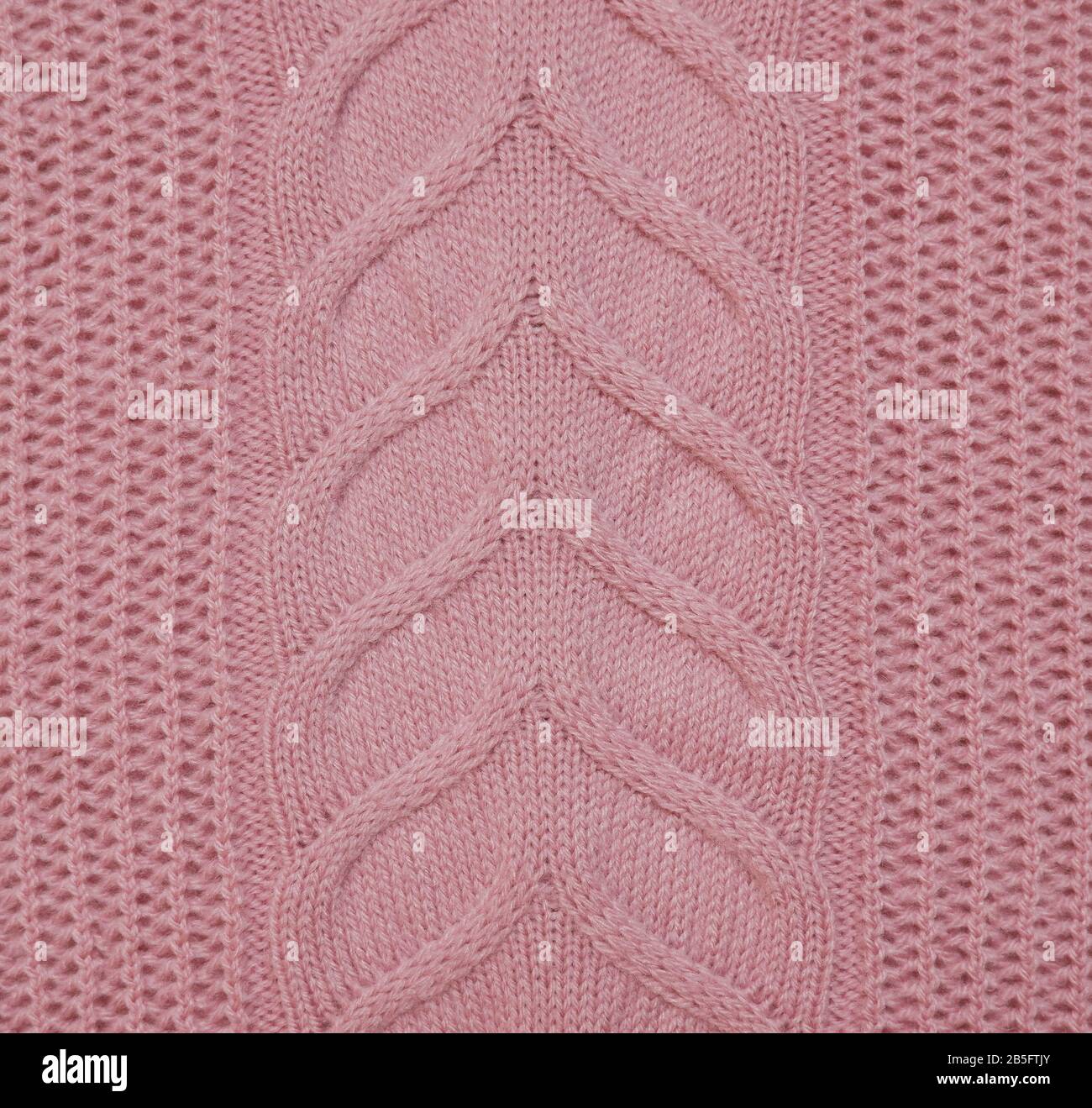 Strickgeflechte pinkfarbene Pullover Material Leinwandtextur Nahaufnahme. Stockfoto