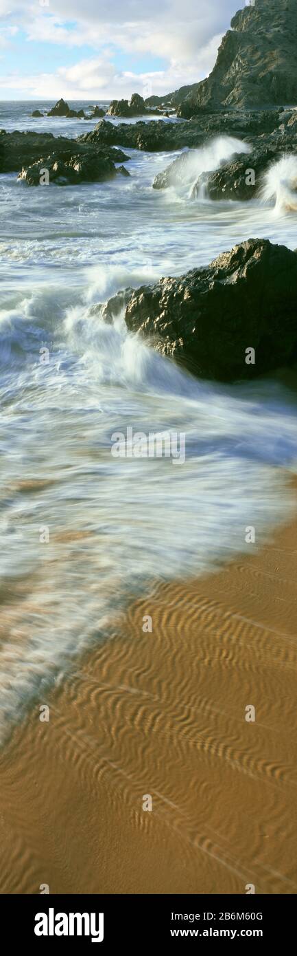 Wellen- und Sandmuster am Strand, Cerritos Beach, Baja California Sur, Mexiko Stockfoto