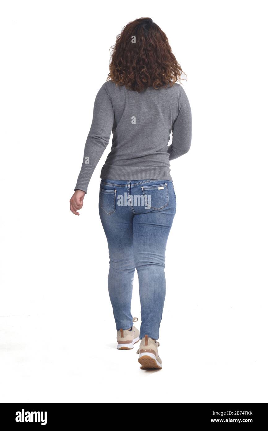 Rückansicht einer Frau, die geht Stockfoto