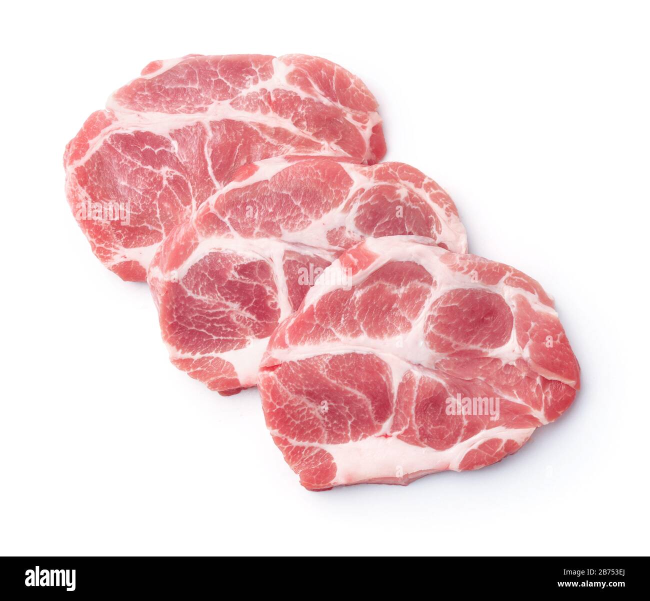 Draufsicht über drei rohe, auf Weiß isolierte Steaks mit frischem Schweinehals Stockfoto