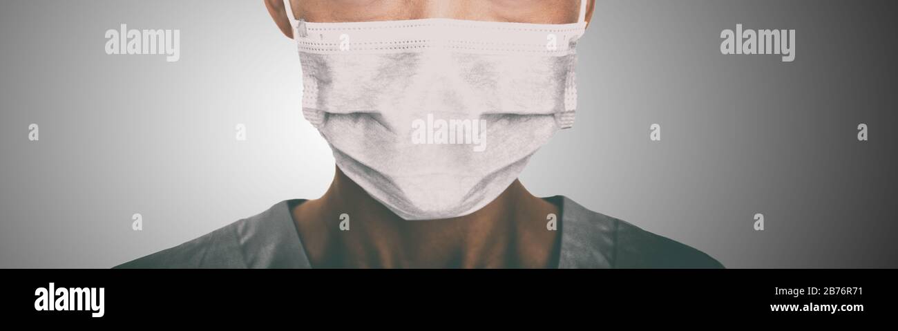 Arzt trägt eine Gesichtsmaske gegen Coronavirus. Banner Panorama medizinisches Personal vorbeugende Ausrüstung. Stockfoto