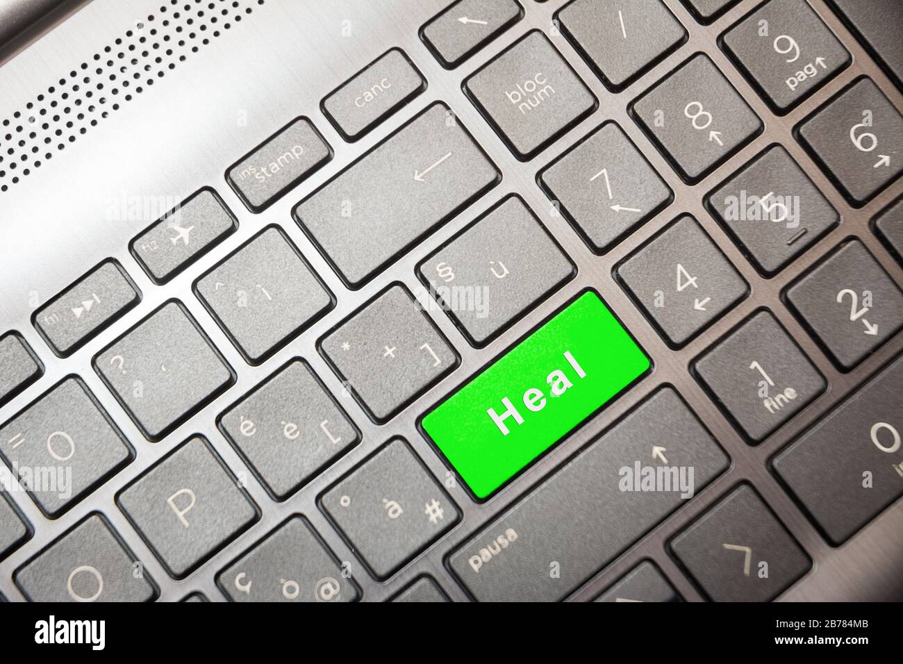 Grüne Taste auf dem Computer mit dem Text "Heal" Stockfoto