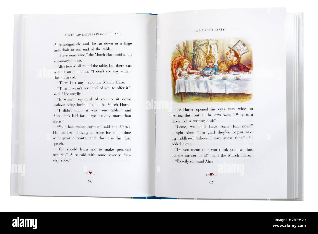 Alice im Wunderland von Lewis Carroll, offen bei einer Illustration von Alice und der Mad Hatter's Tea Party Stockfoto