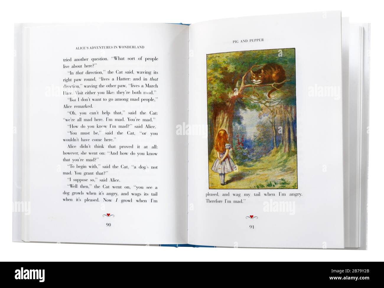 Alice im Wunderland von Lewis Carroll, offen bei einer Illustration von Alice und der Cheshire Cat. Stockfoto