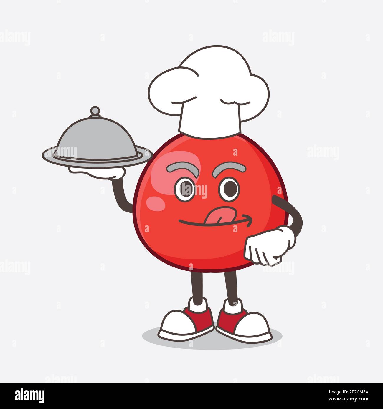 Ein Bild der Figur des Red Berry Cartoon Maskottchens als Koch mit Speisen auf dem Tablett bereit zum servieren Stockfoto
