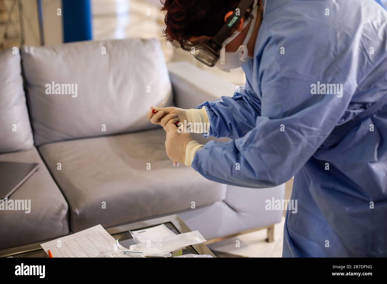 Bucharest, Romania - March 13, 2020: Details with the hands of a medic using a coronavirus test on a person. Stockfoto