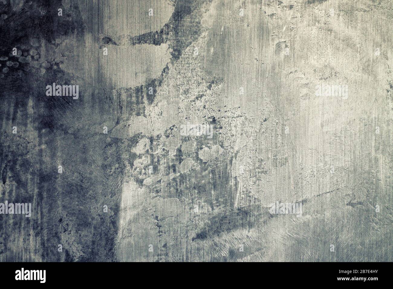 Abstrakter grauer Hintergrund mit Kratzern und Flecken. Stockfoto