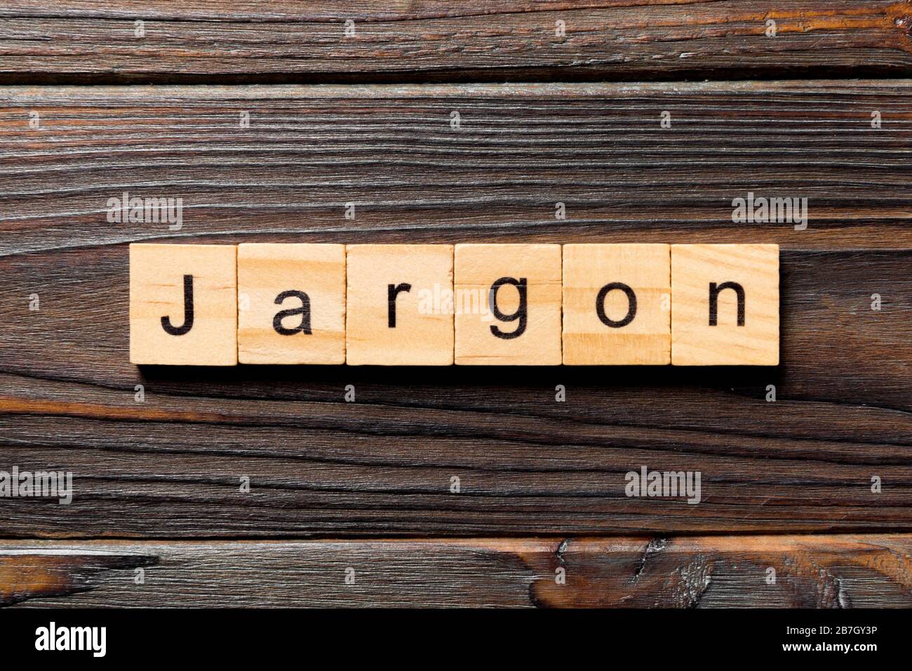 Fachjargon Wort auf Holzblock geschrieben. Jargon Text auf Holztisch für Ihr Desing, Top View Konzept. Stockfoto