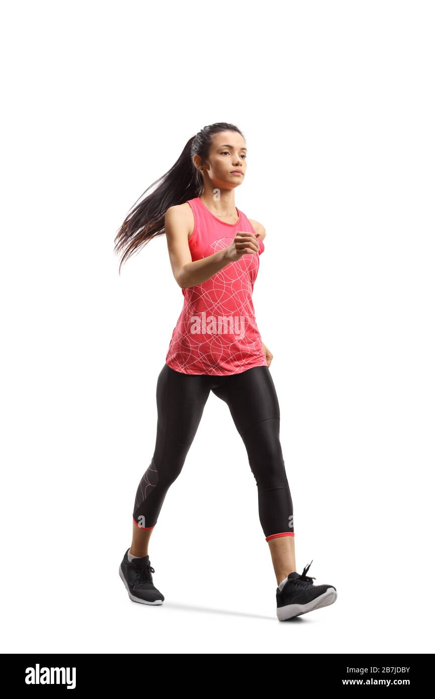 Ganzkörperaufnahme einer jungen Frau im Sportswear-Training schnelles gehen isoliert auf weißem Hintergrund Stockfoto