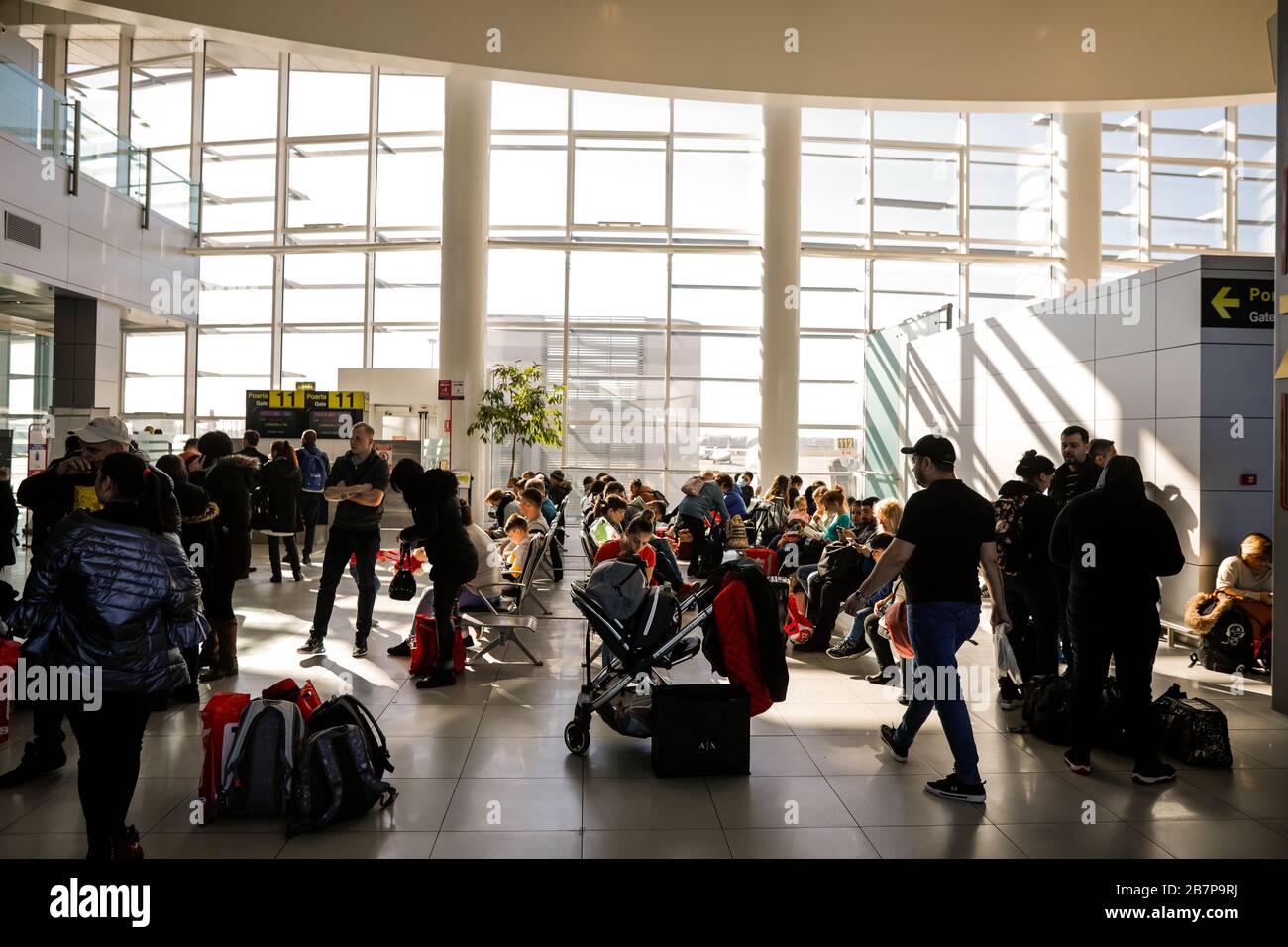 Otopeni, Romania - February 25, 2020: Passengers inside Henri Coanda International Airport, near Bucharest, Romania. Stockfoto