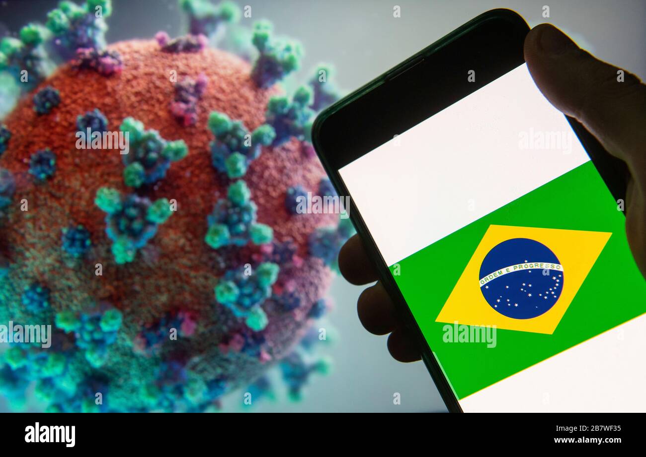 China. März 2020. In dieser Abbildung wird das Flaggenlogo der Bundesrepublik Brasilien auf einem Smartphone mit einem Computermodell des Coronavirus COVID-19 im Hintergrund angezeigt. Kredit: Budrul Chukrut/SOPA images/ZUMA Wire/Alamy Live News Stockfoto