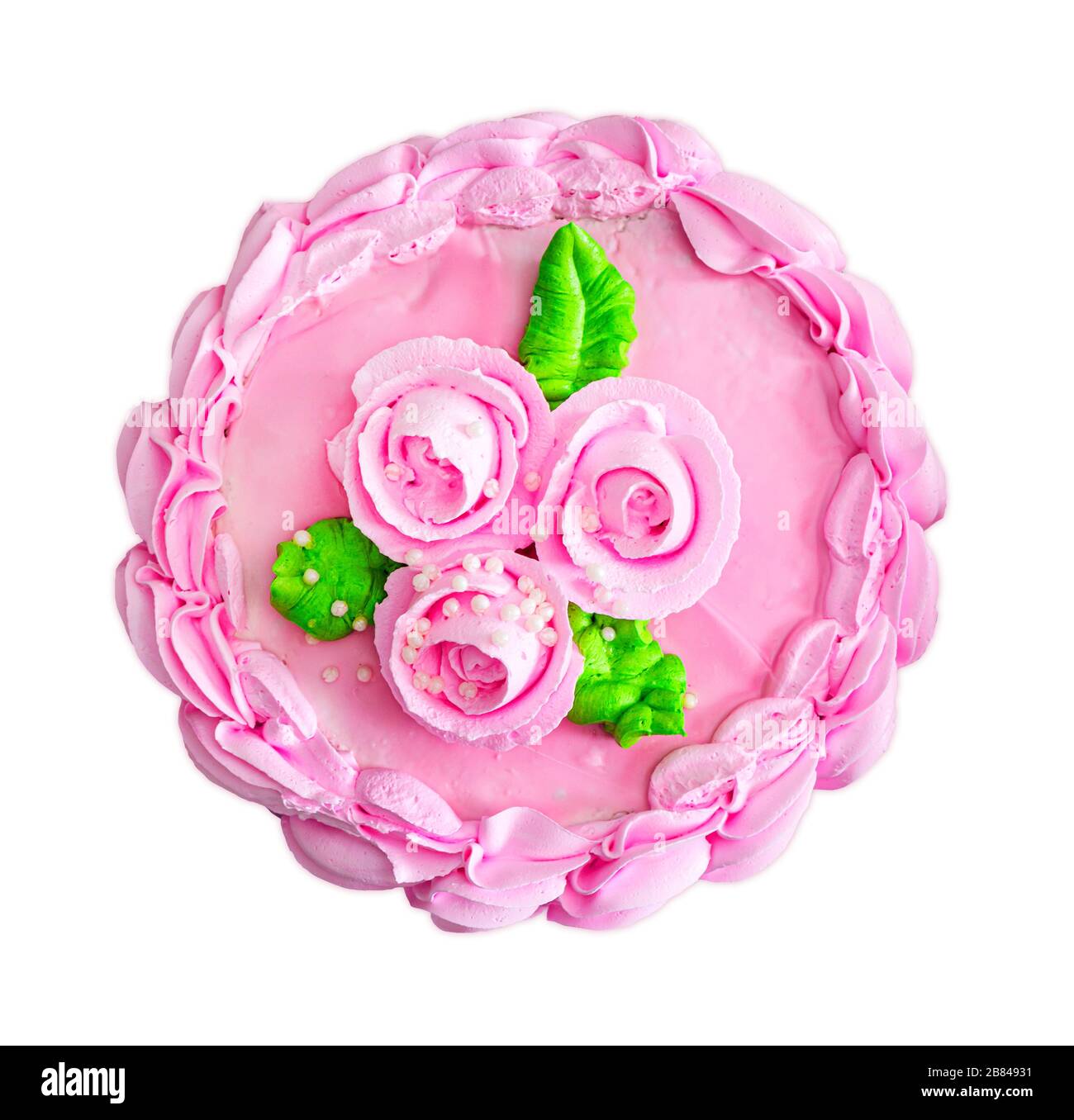 Bunte Kuchen mit cremefarbenen Blumen und isoliert auf weißem Hintergrund. Rosa Cremekuchen Draufsicht. Isolierter Kuchen. Stockfoto
